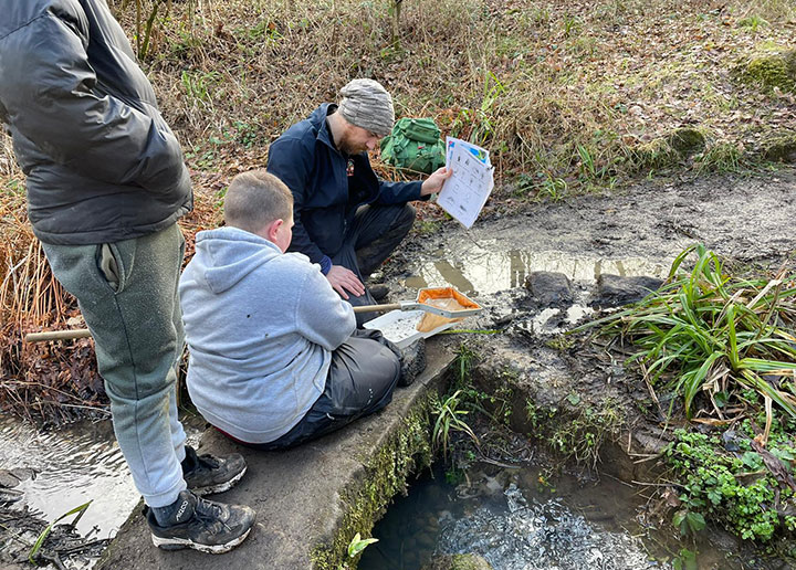 Boy pond dipping 
