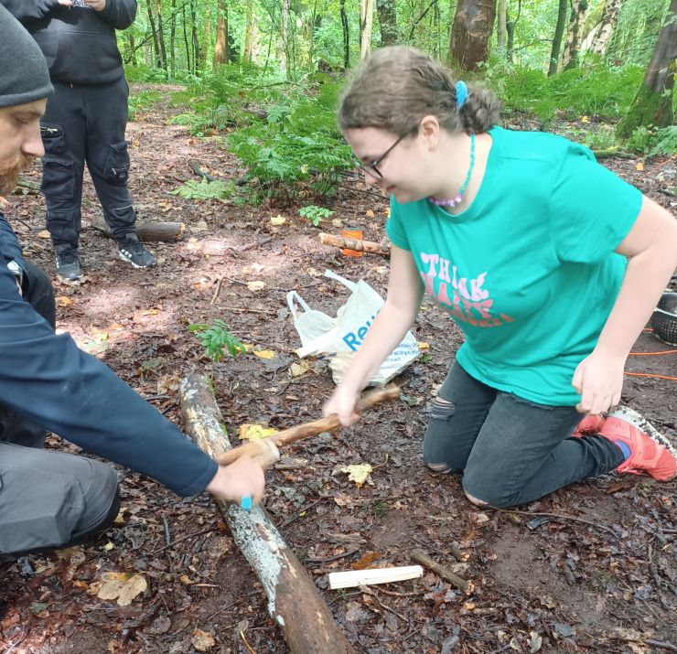 Girl in a green tshirt taking part in tool use